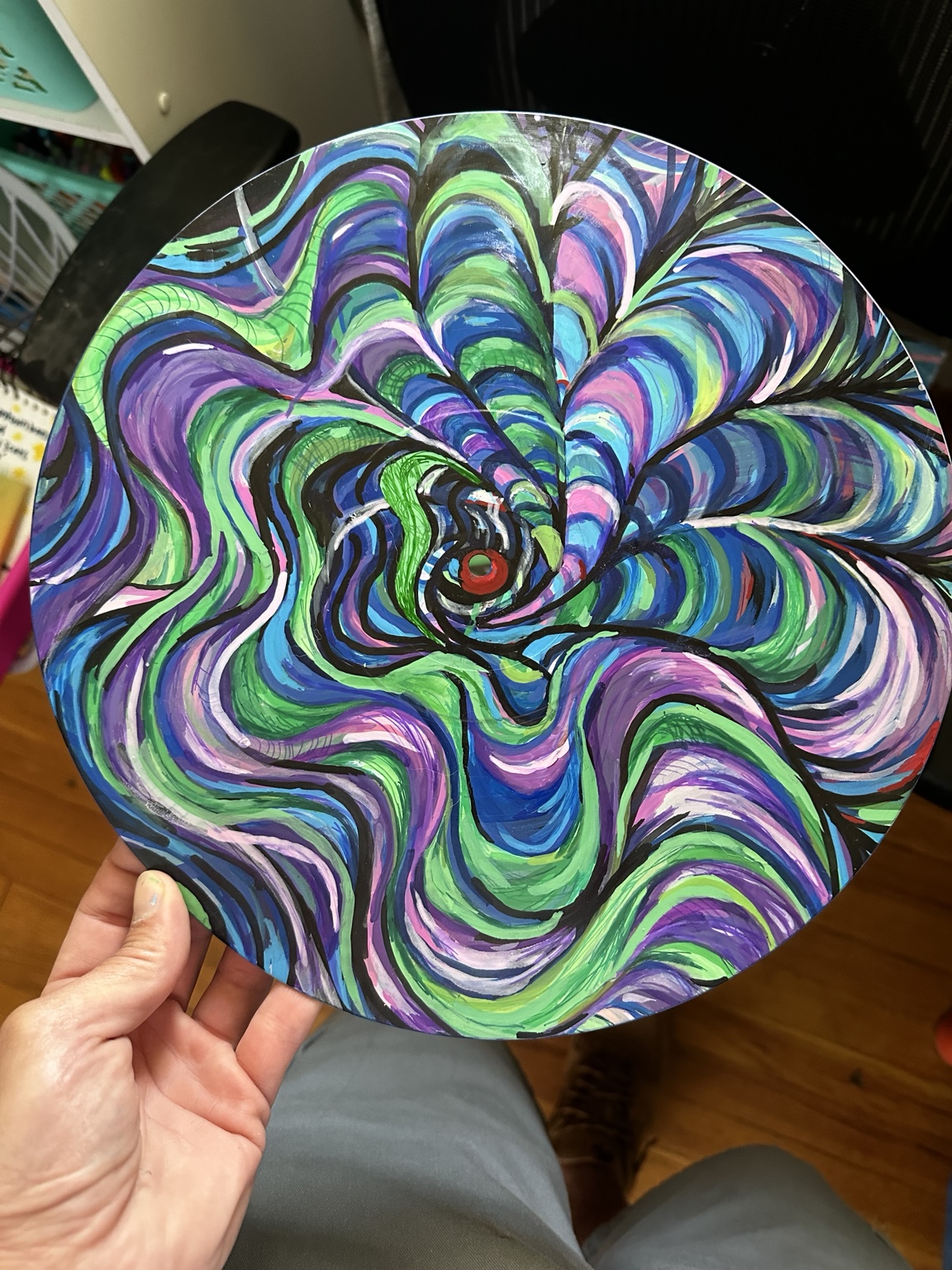 Circular spiral painting in blue green and purple